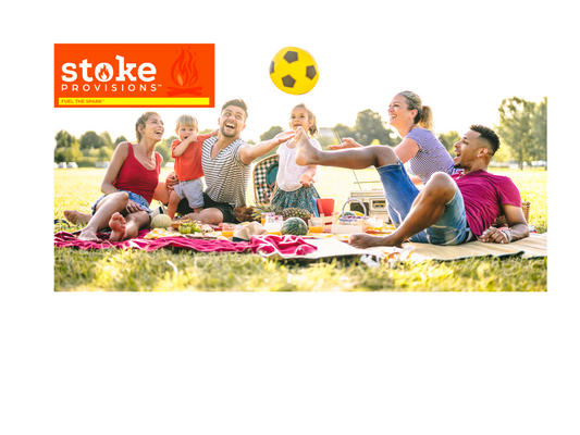A diverse group of individuals enjoying a vibrant outdoor picnic in a scenic national park, surrounded by lush greenery and mountains, with a colorful spread of high-protein meals.
